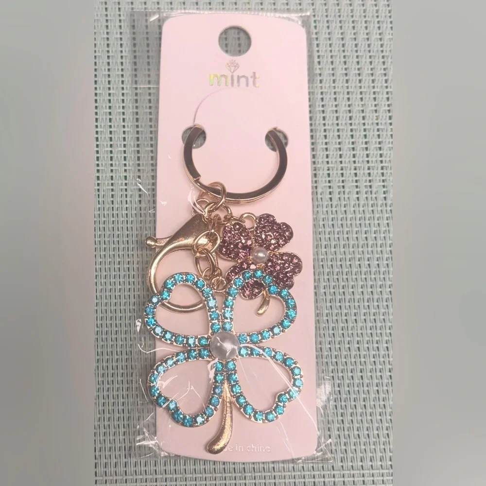 Gold and Blue Rhinestone Keychain with pink clover. New
